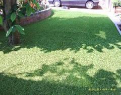 A simple artificial grass job with a garden wall